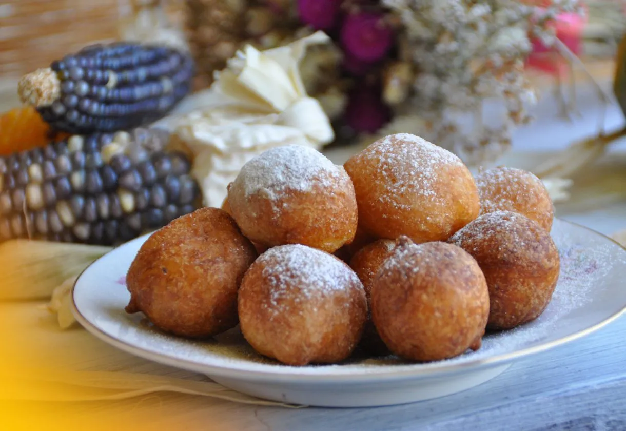 DALL·E 2024 06 05 16.07.31 A table with all the ingredients needed for making bolinho de chuva flour sugar eggs milk baking powder oil and a mixture of sugar and cinnamon