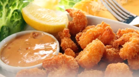 DALL·E 2024 06 06 10.22.07 A detailed high quality image of all the ingredients for making breaded shrimp laid out on a clean white countertop. The ingredients include 500g of 1