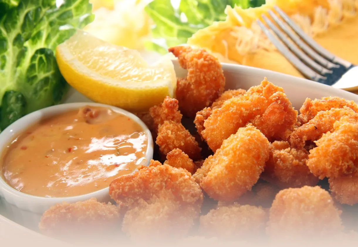 DALL·E 2024 06 06 10.22.07 A detailed high quality image of all the ingredients for making breaded shrimp laid out on a clean white countertop. The ingredients include 500g of 1