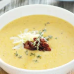 DALL·E 2024 06 07 16.00.44 A detailed high quality image showing all the ingredients needed for making a creamy potato soup including potatoes onions garlic milk cream an 1 1